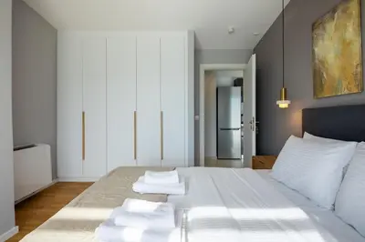 a bedroom with a bed with towels on it at Athens Sky Loft in Athens