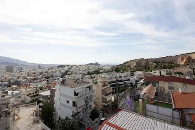 a view of a city with buildings and mountains at Athens Sky Loft in Athens