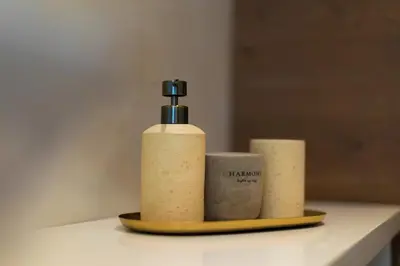 two bottles of soap on a plate on a counter at City Lights Residence Psyxiko in Athens