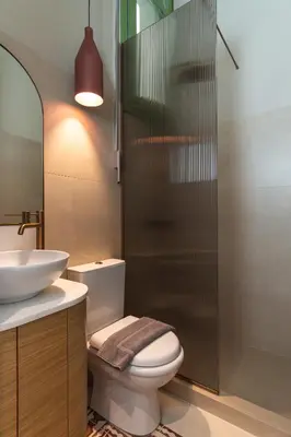 a bathroom with a toilet and a sink at Ogigou Suites in Athens