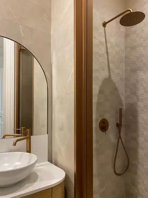 a bathroom with a sink and a shower at Ogigou Suites in Athens