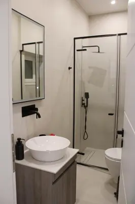 a bathroom with a sink and a shower at ARIS Urban Exarchia in Athens
