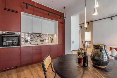 a dining room with a table and a kitchen at Athenian Sky, Two Bedroom Apartment in Koukaki in Athens