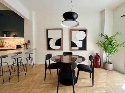 a dining room with a table and chairs at Chic Central Gem Walk to Acropolis in 10 minutes in Athens