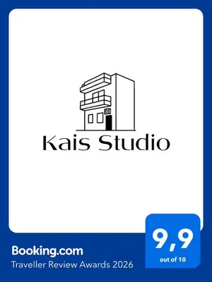 a building logo with the words koalls studio at Kais 1st floor studio in Athens