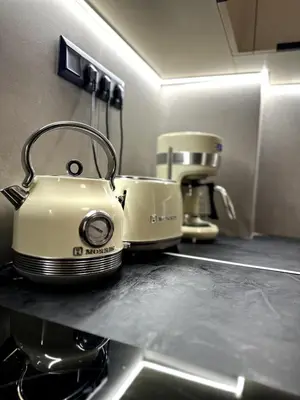 a toaster sitting on top of a kitchen counter at Her Luxury Apartment in Athens