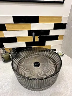 a large metal bowl in front of a wall at Her Luxury Apartment in Athens