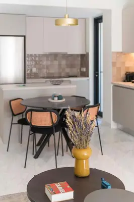a kitchen and dining room with a table and chairs at The HostMaster WiseView Azure in Athens