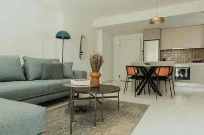 a living room with a couch and a table at The HostMaster WiseView Azure in Athens
