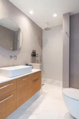 a bathroom with a sink and a toilet and a mirror at The HostMaster WiseView Azure in Athens