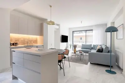a kitchen and living room with a couch and a table at The HostMaster WiseView Azure in Athens