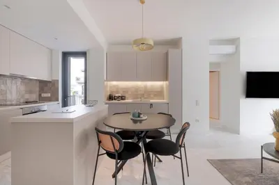 a kitchen with a table and chairs in a room at The HostMaster WiseView Azure in Athens