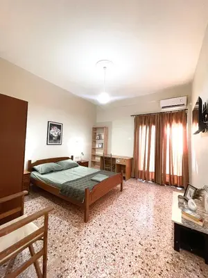 a bedroom with a bed and a desk in it at The Athenian Filo by Mountain Hotels in Athens