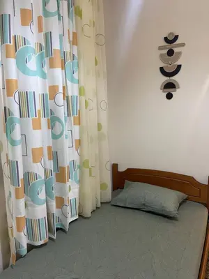 a bedroom with a bed with a canopy and a curtain at The Athenian Filo by Mountain Hotels in Athens