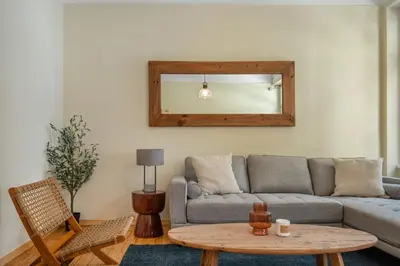 a living room with a couch and a table at Grand Haven - New Renovated Spacious Apts in Prime Location in Athens