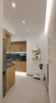 a kitchen with a toilet in the middle of a room at Condo, Hilton & Caravel area, Athens Center in Athens