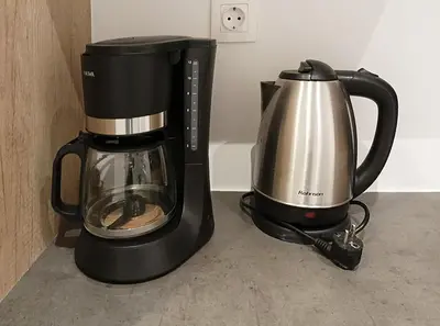 a coffee maker and a coffee pot on a counter at Condo, Hilton & Caravel area, Athens Center in Athens
