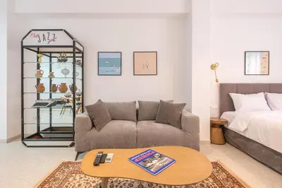 a living room with a couch and a coffee table at Spacious Apartment With Private Garden - Zen Demeter in Athens
