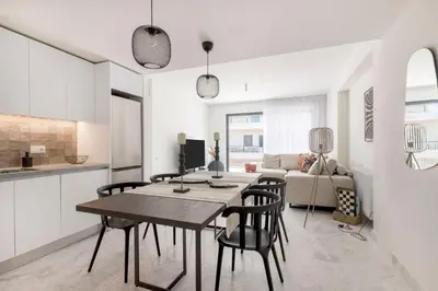 a kitchen and living room with a table and chairs at The HostMaster WiseView Panorama in Athens