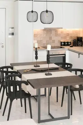 a dining room with a table and chairs in a kitchen at The HostMaster WiseView Panorama in Athens