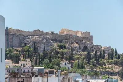 a view of the acropolis from the city of athens at Urban Couples Retreat With Rooftop Access - Zen Selene By Tessera in Athens