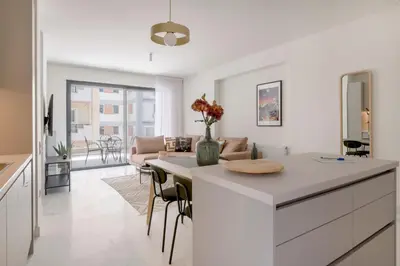 a kitchen and living room with a table and chairs at The HostMaster WiseView Celeste in Athens