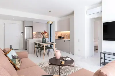 a living room with a couch and a table at The HostMaster WiseView Celeste in Athens