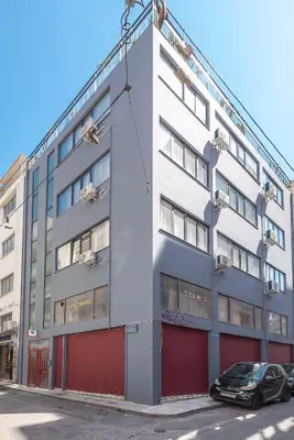 an apartment building with a car parked in front of it at Spacious Designed Studio City Center - Zen Metis By Tessera in Athens