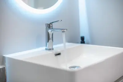 a sink with a faucet in a bathroom at Spacious Designed Studio City Center - Zen Metis By Tessera in Athens