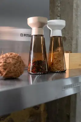 two bottles of seasoning sitting on a shelf at Unique & Stylish Living in Kipseli in Athens