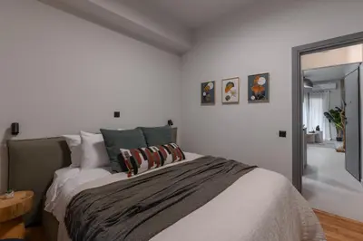 a bedroom with a large bed with pillows on it at Unique & Stylish Living in Kipseli in Athens