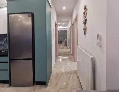 a hallway with a refrigerator in a room at Keti's Elite in Athens