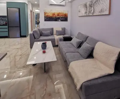 a living room with two couches and a table at Keti's Elite in Athens
