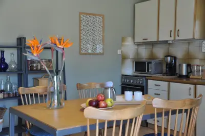 a kitchen with a wooden table with fruit on it at The BloomYard in Markopoulo