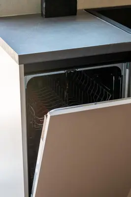 an oven with its door open in a kitchen at Glyfada Aelia Prestige in Athens