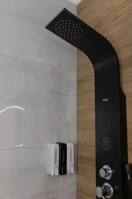 a remote control sitting on top of a counter at The Secret Garden Stay in Athens