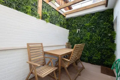 a table and two chairs sitting on a patio at The Secret Garden Stay in Athens