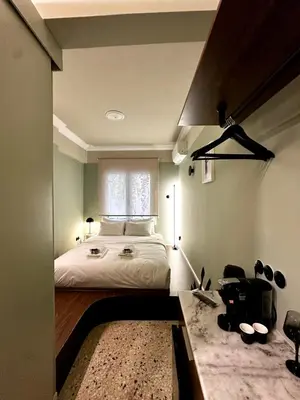 a bedroom with a large bed and a window at Aura, Sis Urban Apartments III in Athens