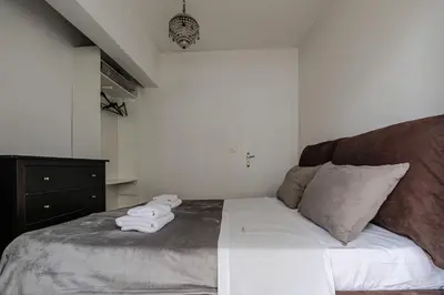 a bedroom with a bed with towels on it at Athens Serenity in Athens