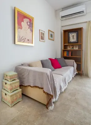 a bedroom with a bed and a book shelf at Spacious 3 Bedroom Apartment With Large Balcony in Athens