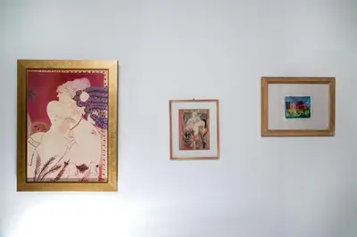 three framed pictures hanging on a white wall at Spacious 3 Bedroom Apartment With Large Balcony in Athens