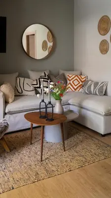 a living room with a couch and a table at Stylish apartment with large terrace in Athens