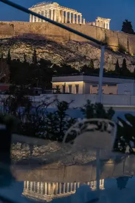 a view of the acropolis of athens at night at Wake Up to the Acropolis in a Hidden Gem in Athens