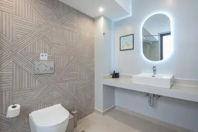 a bathroom with a toilet and a sink and a mirror at Spacious Couples Studio with Seating Area & Rooftop Vibes Zen Gaia By Tessera in Athens