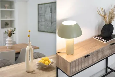 a table with a lamp and a bowl of fruit on it at Warm Athenian 2BR Apartment by Acropolis Hill by UPSTREET in Athens