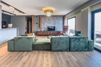 a living room with a couch and a table at Phaedrus Living Apollo Skyview Penthouse in Athens