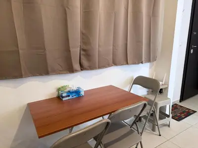 a table and chairs in a room with a curtain at Alimos Cozy Apartment in Athens