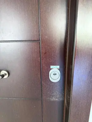 a metal door with a sign that says elevator at Alimos Cozy Apartment in Athens