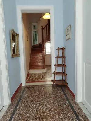 a hallway with a stairway with a stair case at Golden room 1 in Athens