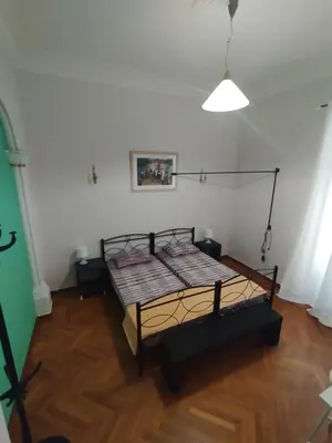 a bedroom with a bed in the corner of a room at Golden room 3 in Athens